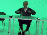human, chromakey, on a green background, the person is working, standing tables of the office