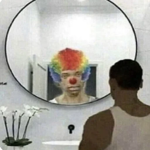 clown, in the mirror, stupid face, looks at the mirror, the clown looks a mirror