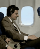 gambe, mr bean, cestino in aereo, mr bean un aereo, elton john mosca 1995